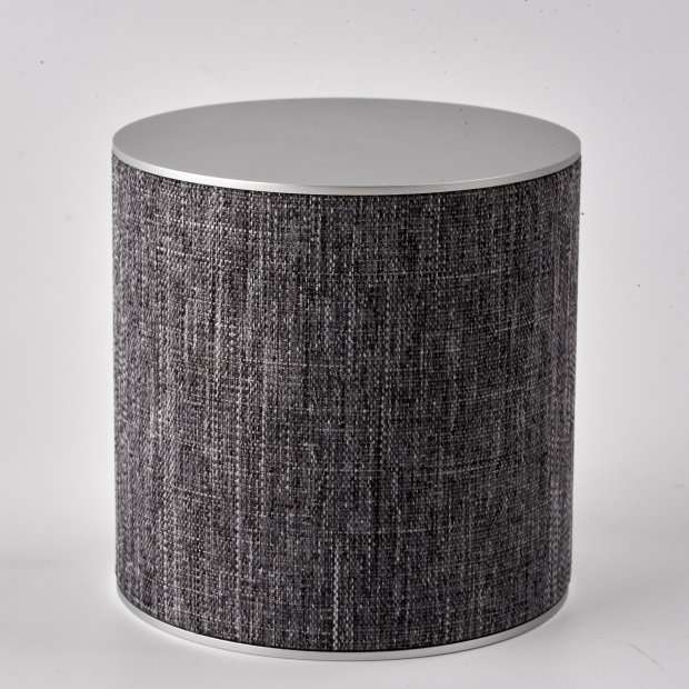 A custom prototype of a cylinder speaker with a premium fabric-wrapped body